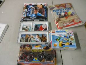 lot 65 image: Star Wars toys, Lego set, and car b...