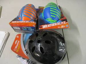 lot 72 image: 2 Nerf footballs and Razor helmet...