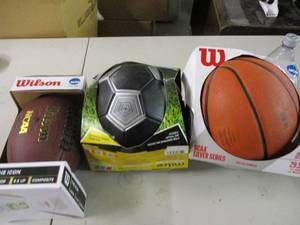 lot 87 image: Football, basketball, and soccer ba...