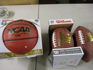 lot 98 image: 2 footballs and a basketball...