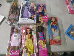 lot 111 image: 4 Barbies and 3 other dolls...
