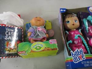 lot 202 image: Baby Alive, Cabbage Patch and Santa...