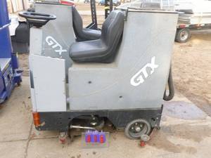 Tomcat GTX 30D floor scrubberdryer. Used condition. Powered up when we put batteries in but would not move. For parts or repair. No batteries included. As shown.