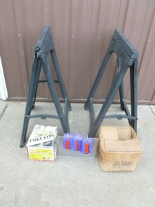 1 Pair of folding saw horses with 2 boxes of nails. As shown.