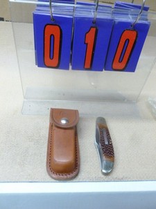 Remington knife & sheath. New condition. As shown.
