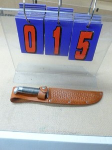 Vintage western knife with sheath. As shown.