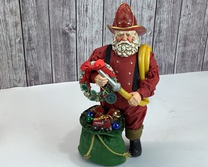 lot 2197 image: Large Clothtique Santa Fireman 12 Tall