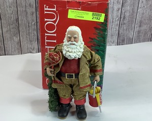 lot 2192 image: Clothtique Firefighter Santa, 11 tall