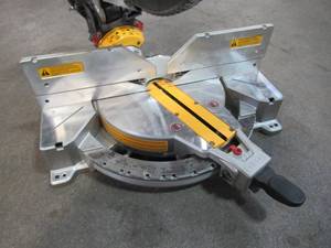 lot 9 image: DEWALT 12 in. 15 Amp Compound Double Bevel Miter Saw DWS716