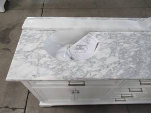 lot 171 image: Home Decorators Collection Windlowe 73 in. W x 22 in. D x 35 in. H Bath Vanity in White with Carrara Marble Vanity Top in White with White Sink 15101-VS73C-WT