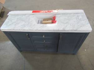 lot 57 image: Home Decorators Collection. Sandon 60 in. W x 22 in. D Bath Vanity in Midnight Blue with Marble Vanity Top in Carrara White with White Basin - Slight Fissure Cracks in Top.