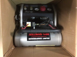 lot 105 image: Husky 4.5 Gal Portable Electric Air Compressor Adjustable Height Handle, Rubber Wheels in good conditions