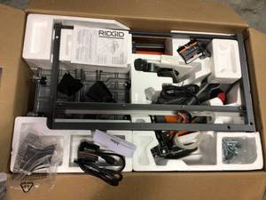 lot 6 image: 9 Amp Corded 7 in. Wet Tile Saw with Stand by RIDGID not used