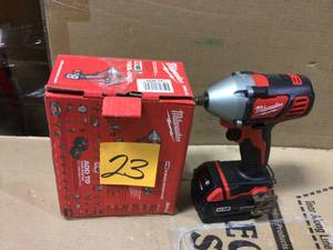 lot 23 image: M18 18-Volt Lithium-Ion Cordless 38 in. Impact Wrench W Friction Ring by&nbsp Milwaukee missing charger in good conditions