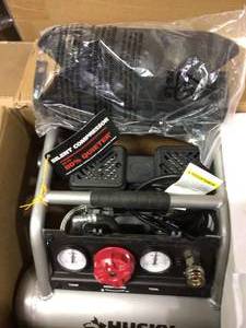 lot 48 image: 1 Gal. Portable Electric-Powered Silent Air Compressor by Husky in good conditions