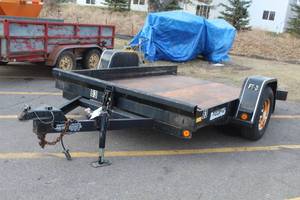 lot 50 image: 2001 Felling FT-3 Tilt Deck Single Axle Utility Trailer with Steel Bed 10