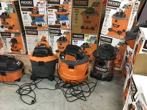 lot 7 image: Pallet of assorted Ridgid Vacuums different sizes some may need repair or have missing pieces