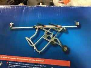 lot 30 image: Portable Folding Gravity Rise Miter Saw Stand with Wheels see pictures
