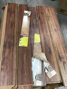 lot 39 image: PALLET OF Distressed Brown Hickory 12 mm Thick x 6-14 in. Wide x 50-2532 in. Length Laminate Flooring (15.45 sq. ft.  case) (27 CASES) (SEE PICS CAREFULLY)