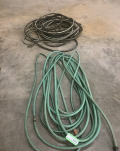 lot 569 image: Two Garden Hoses