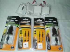 lot 8 image: Duracell car chargers & audio cables. No name earbuds.