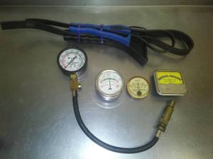 lot 325 image: Gauges, 2 strap wrenches, compression tester