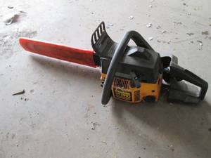 lot 5 image: Chainsaw, has compression...