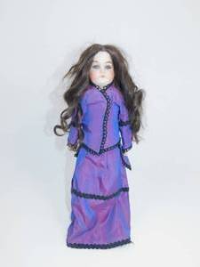 lot 4 image: Collectible Porcelain Doll with Purple Dress and Stand
