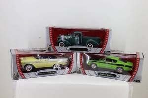 lot 32 image: 118 37 Studebaker, 56 Chevy BelAir, 69 Plymouth Barraacuda