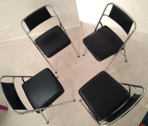 lot 9 image: Set of Four Chrome and Faux Leather Folding Chairs