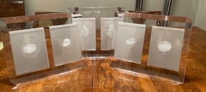 lot 28 image: Three Lucite Photo Frames