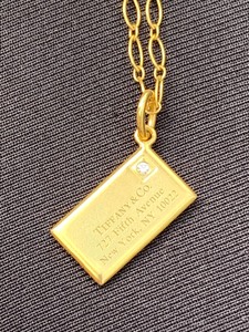 lot 162 image: 14k Tiffany & Co Envelope Pendant and Chain