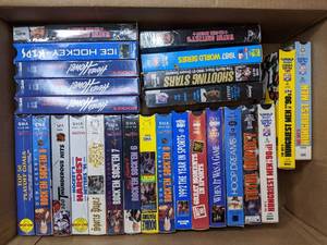 lot 85 image: Box of NHL (and a few MLB, NFL, etc.) VHS Tapes