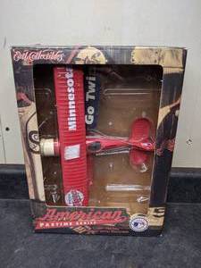 lot 101 image: NIB Minnesota Twins Diecast Airplane Bank by Ertl