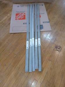 lot 58 image: 5 Strand Woven Bamboo Earl Grey .598 in. Thick x 1.98 in Wide x 72 in. Length Bamboo T Molding- open box not used