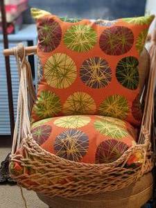 lot 77 image: Swinging Macrame Porch Swing with Cushions