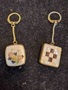 lot 118 image: Vintage Wind-up Music Box Keychains by Sankyo - Both Work