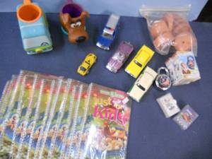lot 54 image: Vintage Scooby Doo Mugs, 12 Just for Kids Cookbooks, Matchbox Cars, Nascar small playing cards, Combination Locks, More