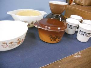 lot 17 image: Pyrex - English JAJ Brown Floral, Old English Cinderella 443, Old Orchard with Lid, Smoky Floral Bowl, Brown Bowl, Yellow Bowl, 4 Corning Black on White Cups