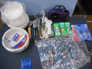 lot 139 image: Styrofoam and Paper Plates and Bowls, Light Bulbs, Kitchen Utensils, CD Cleaner, Huge bag of blue crayon pencils