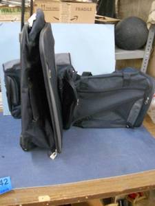 lot 142 image: New Rolling Suitcase, Duffle, and Laptop Case - Navy Blue and Grey
