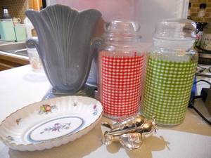 lot 195 image: Red Wing baby blue and pink Vase, Anchor Hocking Gingham Apothecary Jars, Spoke Plate, Reed and Barton Airplane Music Box - Music Box Part is Missing