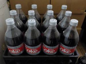 lot 165 image: Case of 12 - 1.25 Bottles Diet Coke...