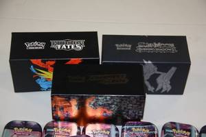 lot 70 image: Empty Pokemon Storage Box and Tin Lot
