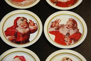 lot 87 image: Coca Cola Christmas Santa Metal Coaster Set
