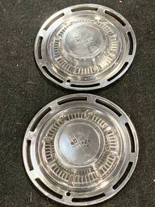lot 89 image: Vintage Chevy Impala Hubcaps