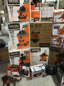 lot 31 image: Pallet with assorted Shop Vacs and other tools see pictures