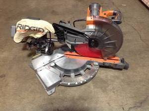 lot 11 image: Ridgid 15 Amp Corded 12 in. Dual Bevel Sliding Miter Saw used see pictures