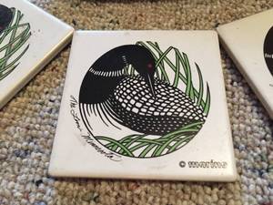 lot 70 image: Four Loon Coasters and Decorative Loon Planter