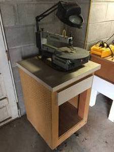 lot 101 image: Dremel 16 Inch Scroll Saw on Rolling Table